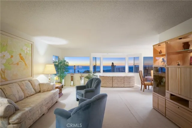 a view of a living room and a floor to ceiling window