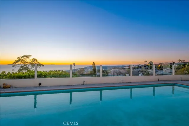 a view of a dry yard with trees
