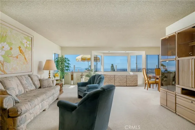 a living room with a large window and table