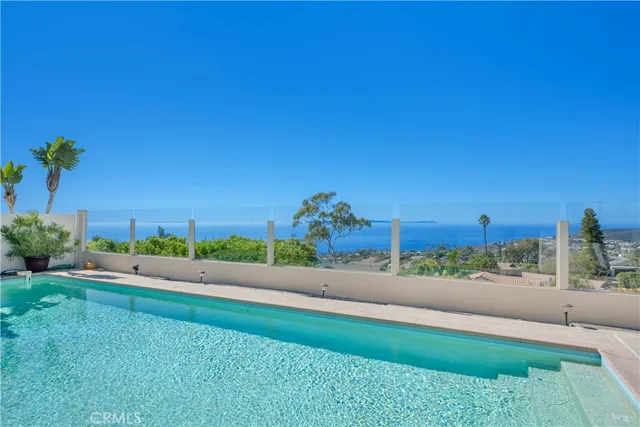 a view of a house with backyard sitting area and garden