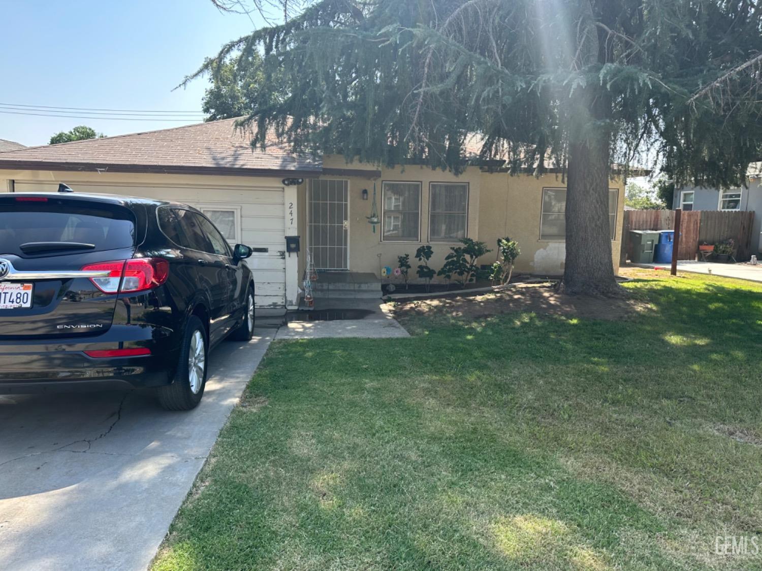 Undisclosed Address Bakersfield, CA 93305 - Photo 2 of 2 a view of a car in front of house