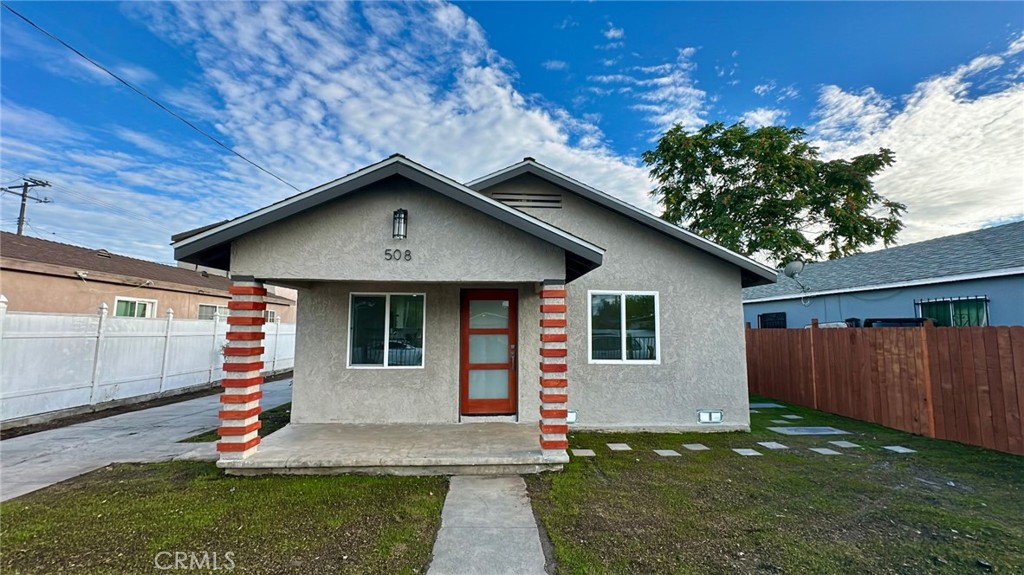 508-508 West Pear Street Compton, CA 90222 - Photo 2 of 14 a front view of a house with garden
