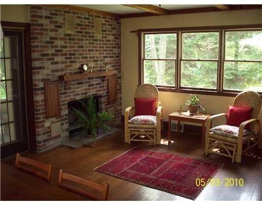 304 Guys Run Road Cheswick, PA 15024 - Photo 3 of 18 Den/Family/Great Room. Family room with pegged hardwood floors, fireplace, built-ins and walk out to screened porch.