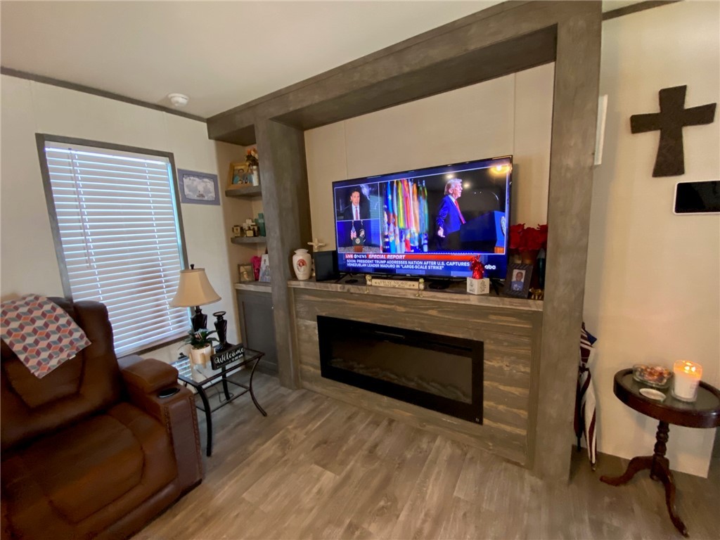 107 Ridgeview College Station, TX 77845 - Photo 11 of 15 a living room with furniture a fireplace and a flat screen tv