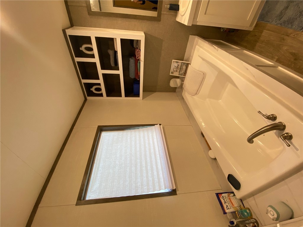 107 Ridgeview College Station, TX 77845 - Photo 7 of 15 a bathroom with a sink and a mirror