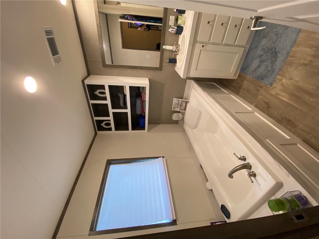 107 Ridgeview College Station, TX 77845 - Photo 9 of 15 a bathroom with a double vanity sink mirror and bathtub