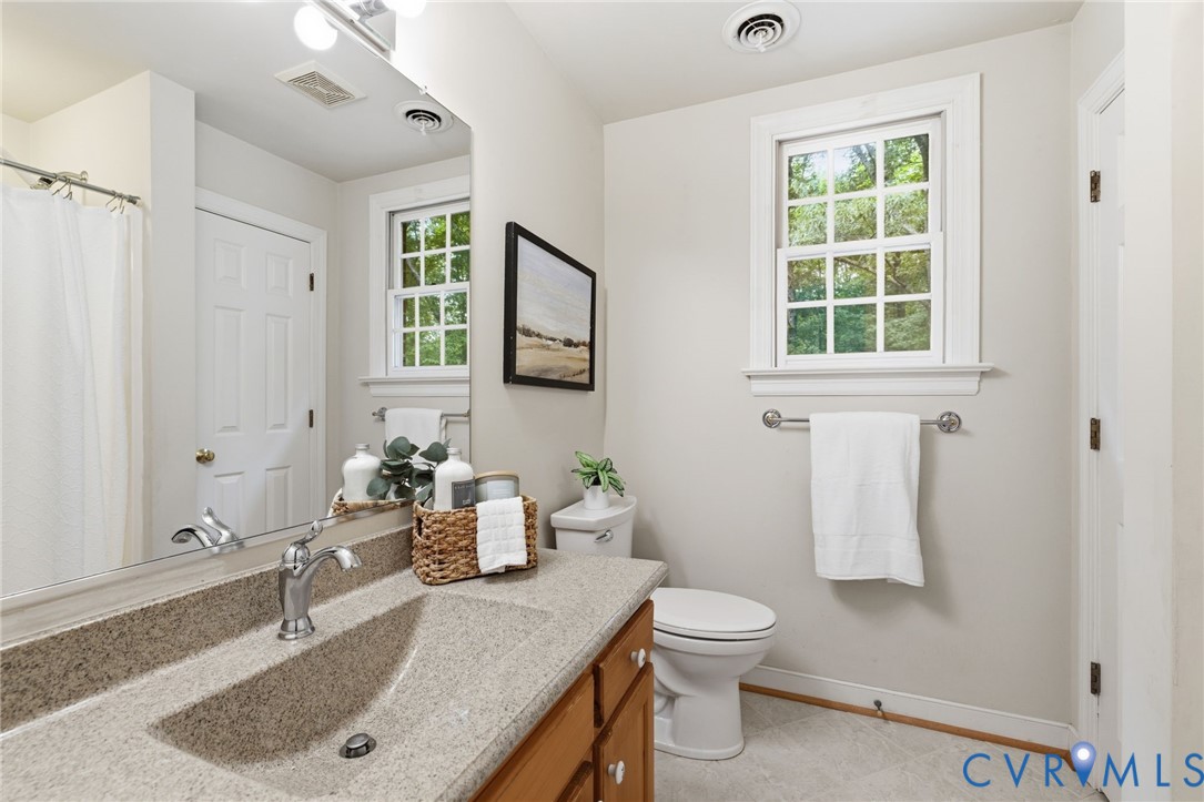 2615 Salisbury Road Midlothian, VA 23113 - Photo 22 of 36 a bathroom with a sink toilet and shower