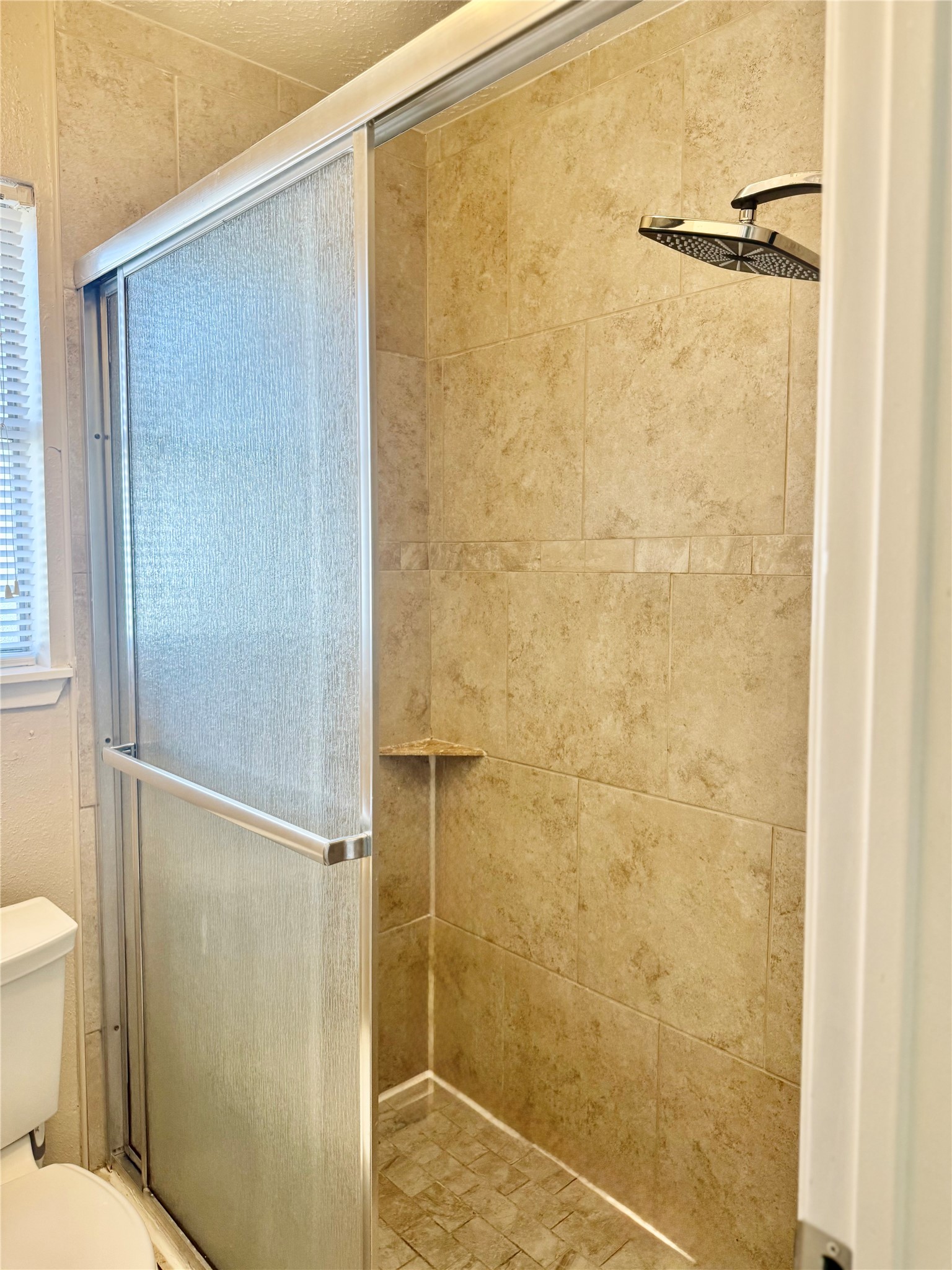 408 Bay Ridge Drive League City, TX 77573 - Photo 12 of 22 a bathroom with a shower and a toilet