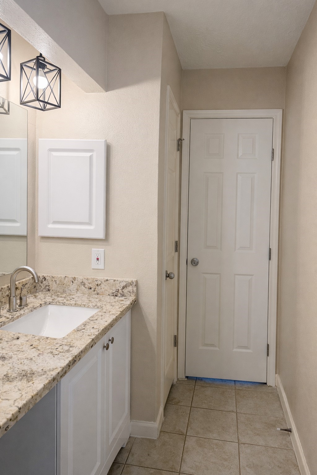408 Bay Ridge Drive League City, TX 77573 - Photo 15 of 22 a bathroom with a granite countertop sink and a mirror