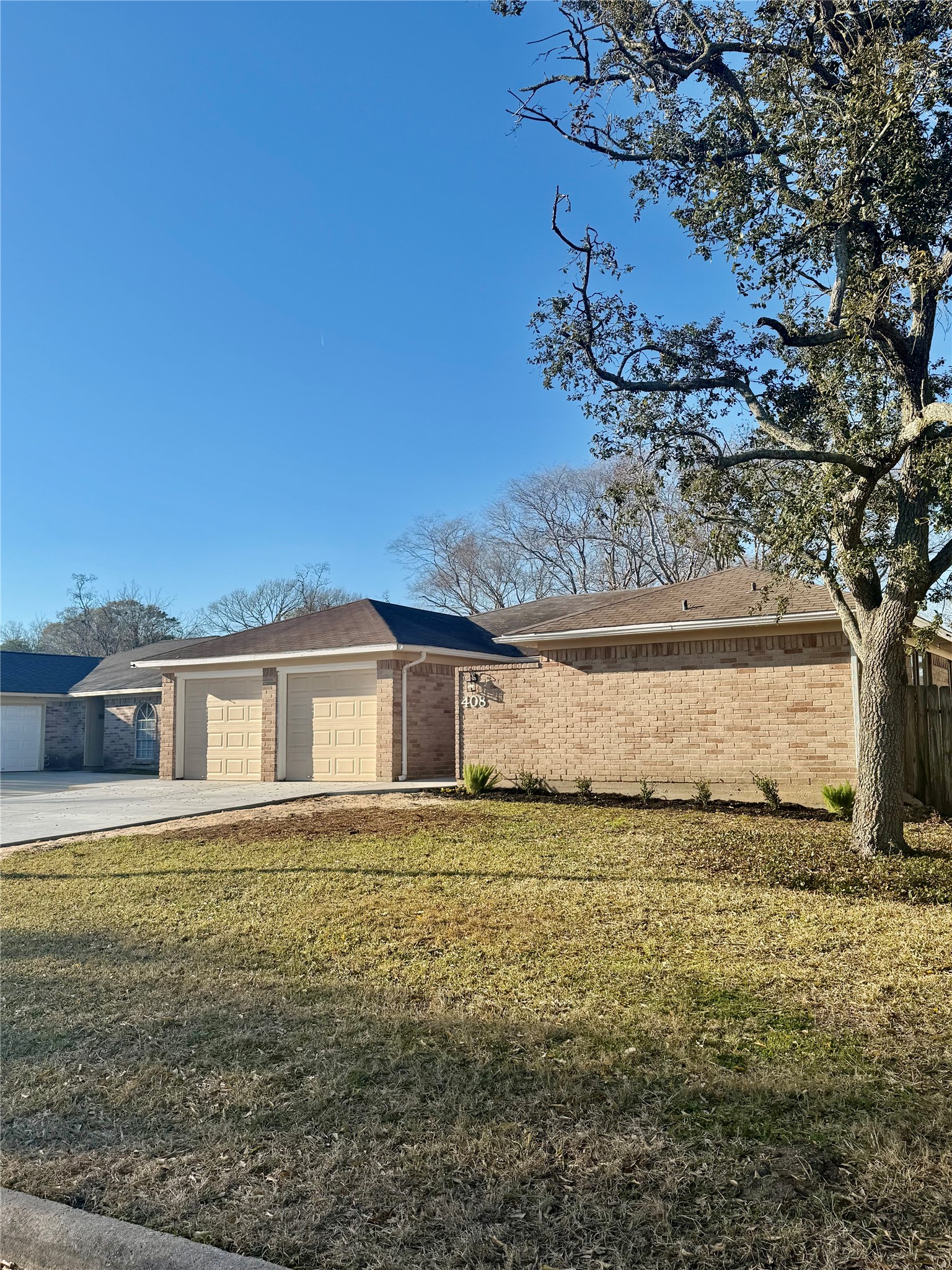 408 Bay Ridge Drive League City, TX 77573 - Photo 21 of 22 a view of a house with a yard