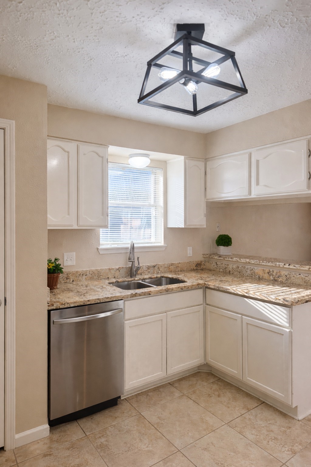 408 Bay Ridge Drive League City, TX 77573 - Photo 7 of 22 a kitchen with stainless steel appliances granite countertop a sink a stove and cabinets