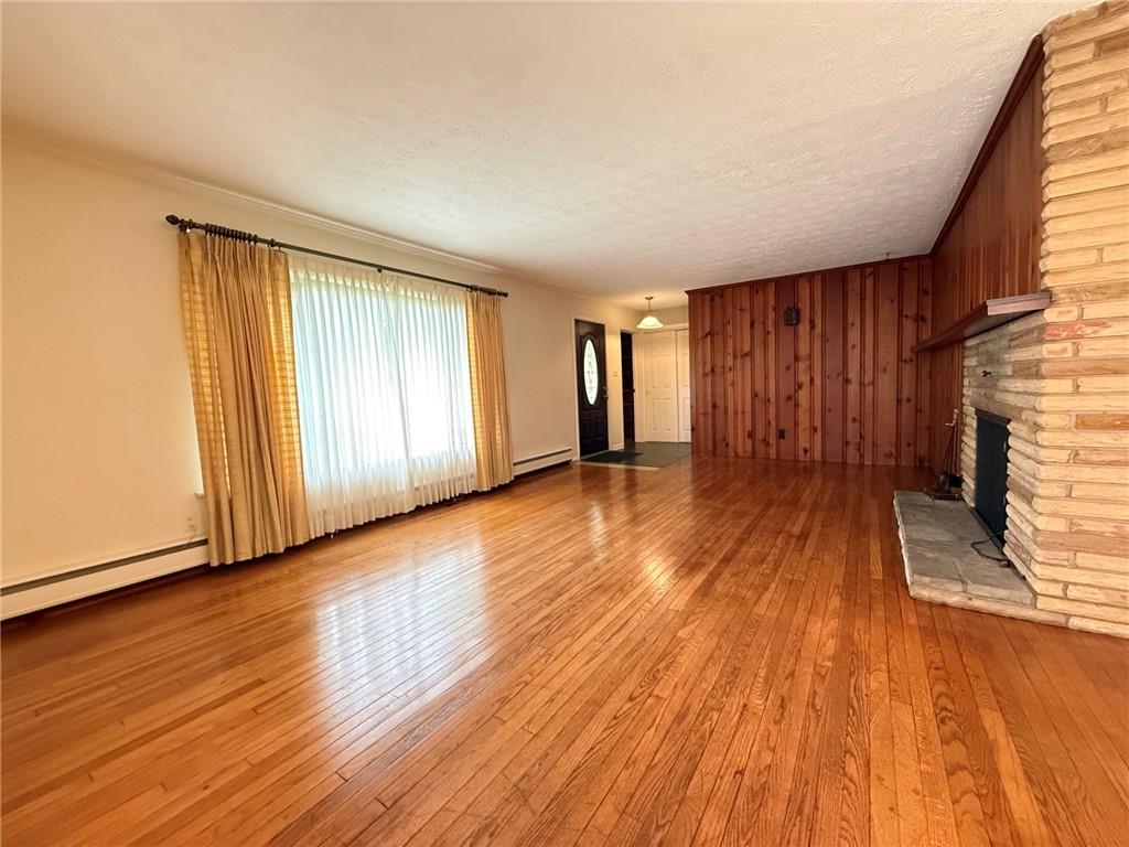 123 Hadley Road Greenville, PA 16125 - Photo 16 of 49 a view of an empty room with wooden floor and a window