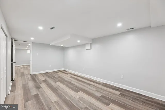 a view of room with wooden floor