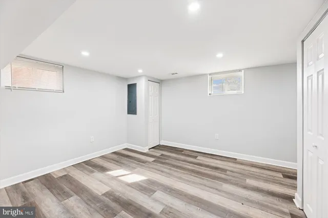 a view of a room with wooden floor