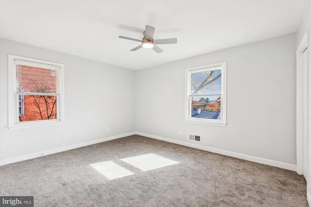 a view of room with window and ceiling fan