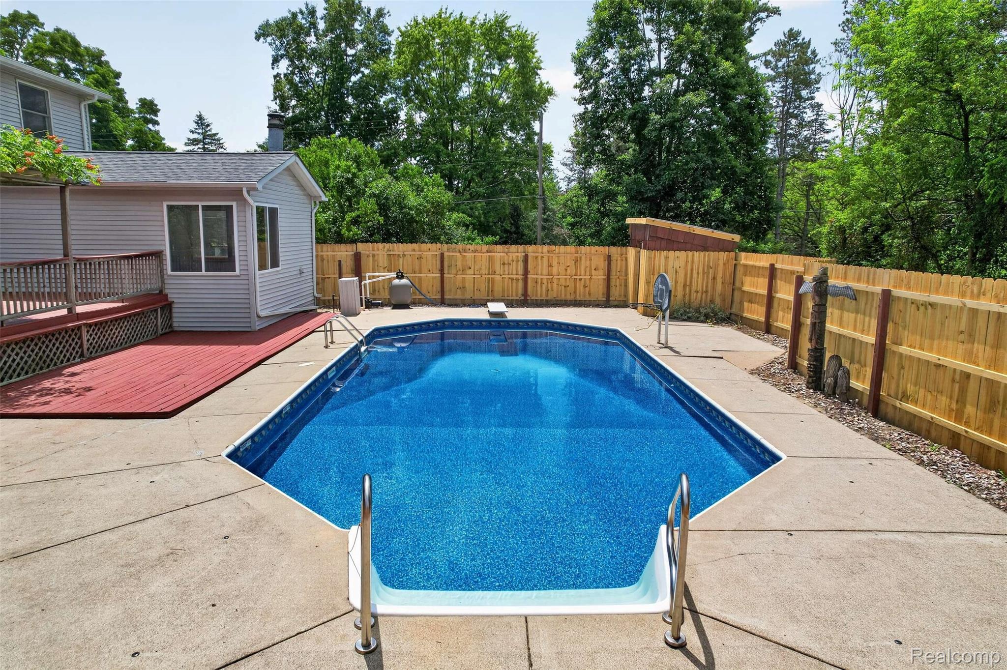 1437 East Cook Road Grand Blanc, MI 48439 - Photo 11 of 69 In-ground swimming pool with concrete surround