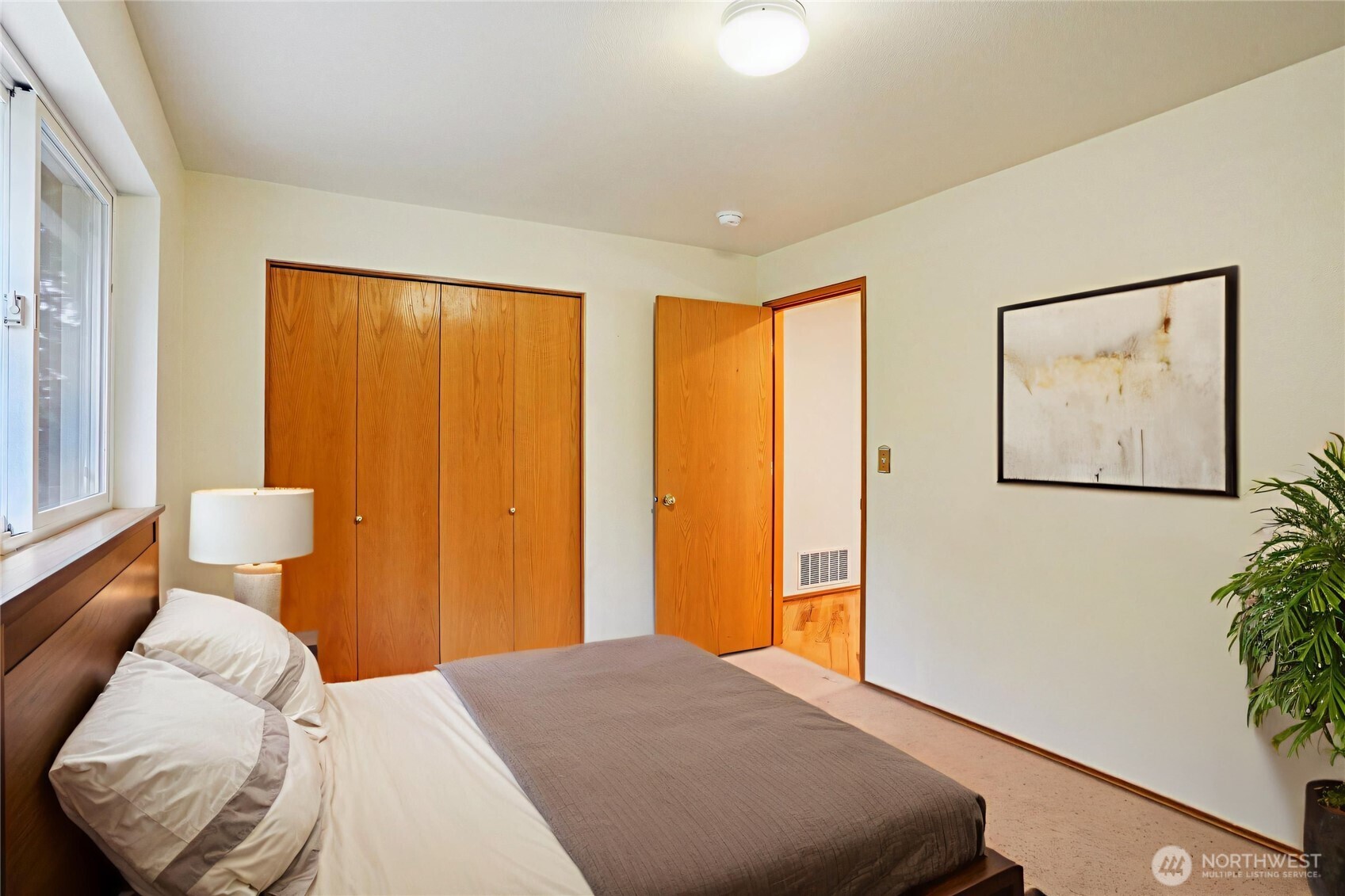 35031 8th Place Southwest Federal Way, WA 98023 - Photo 29 of 36 a bedroom with a bed and a potted plant