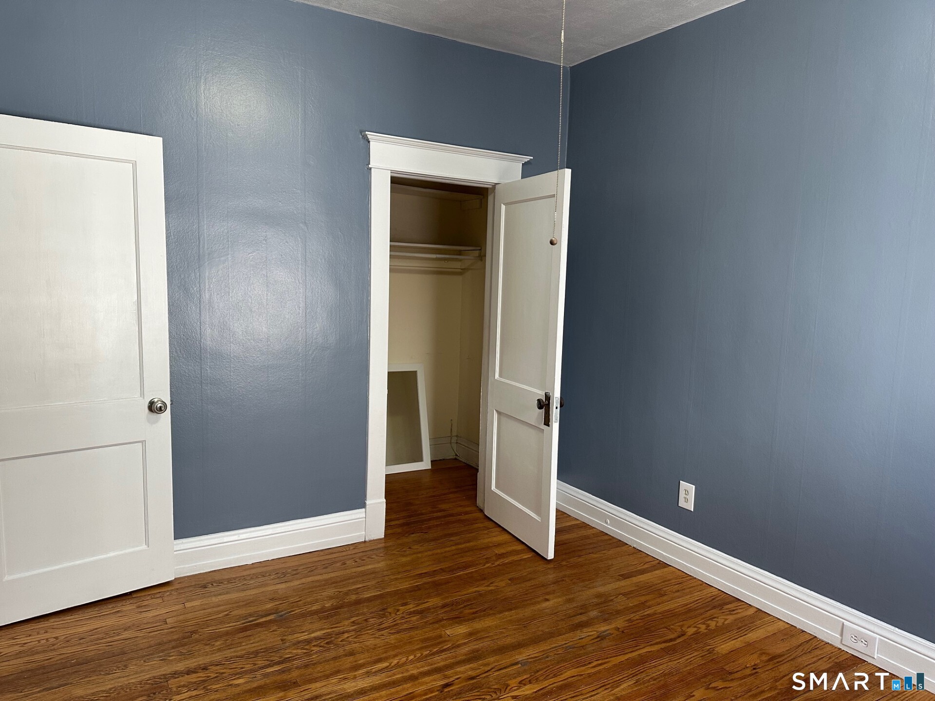 20 Taylor Street Torrington, CT 06790 - Photo 15 of 19 a view of an empty room with wooden floor and closet