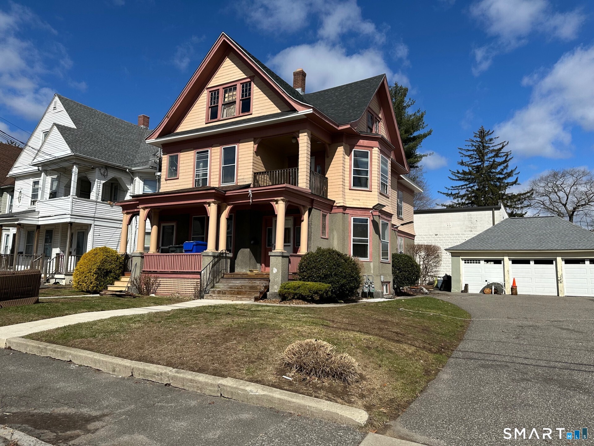 20 Taylor Street Torrington, CT 06790 - Photo 3 of 19 a front view of a residential apartment building with a yard