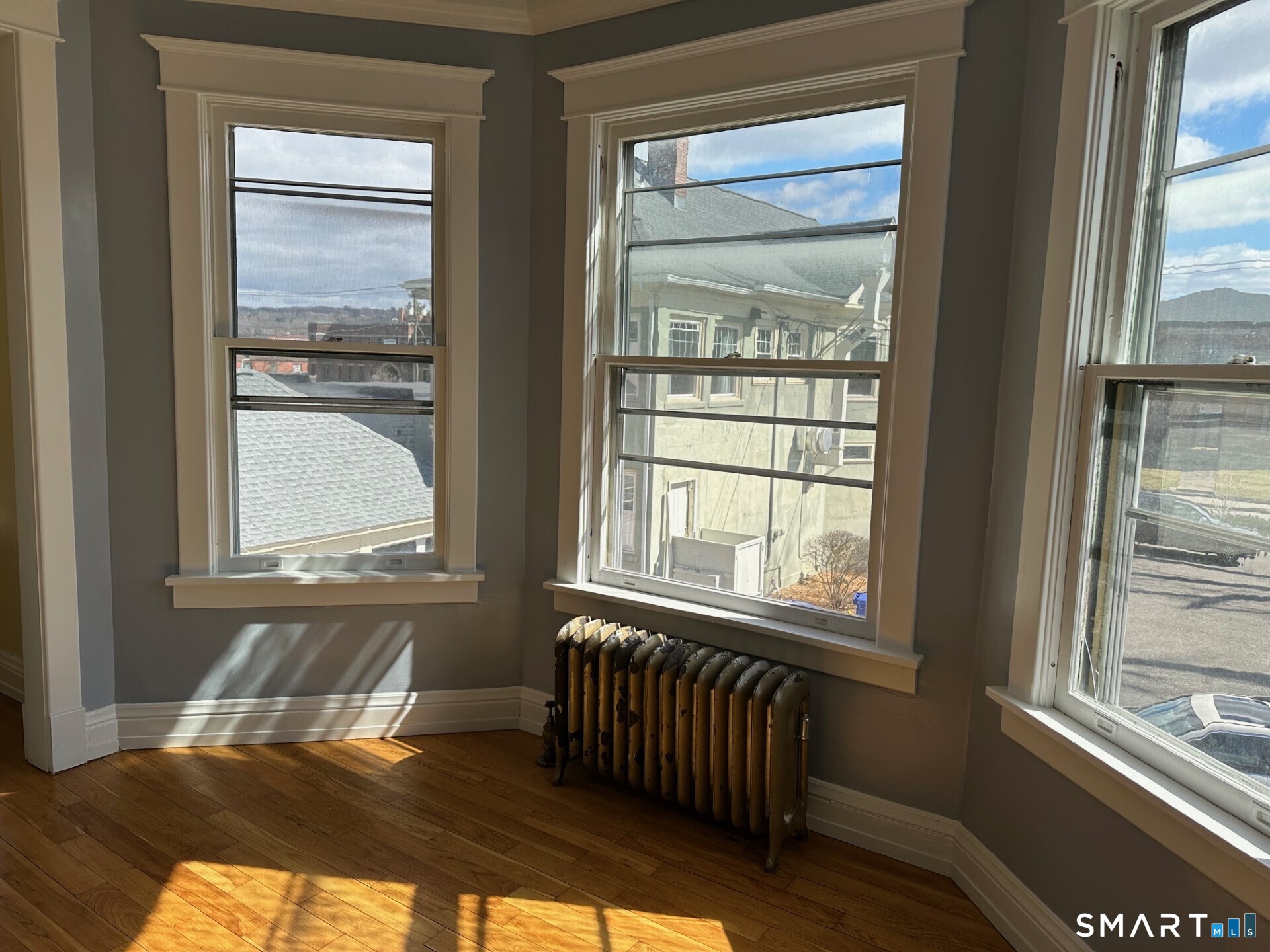 20 Taylor Street Torrington, CT 06790 - Photo 5 of 19 a bedroom with a bed and wooden floor