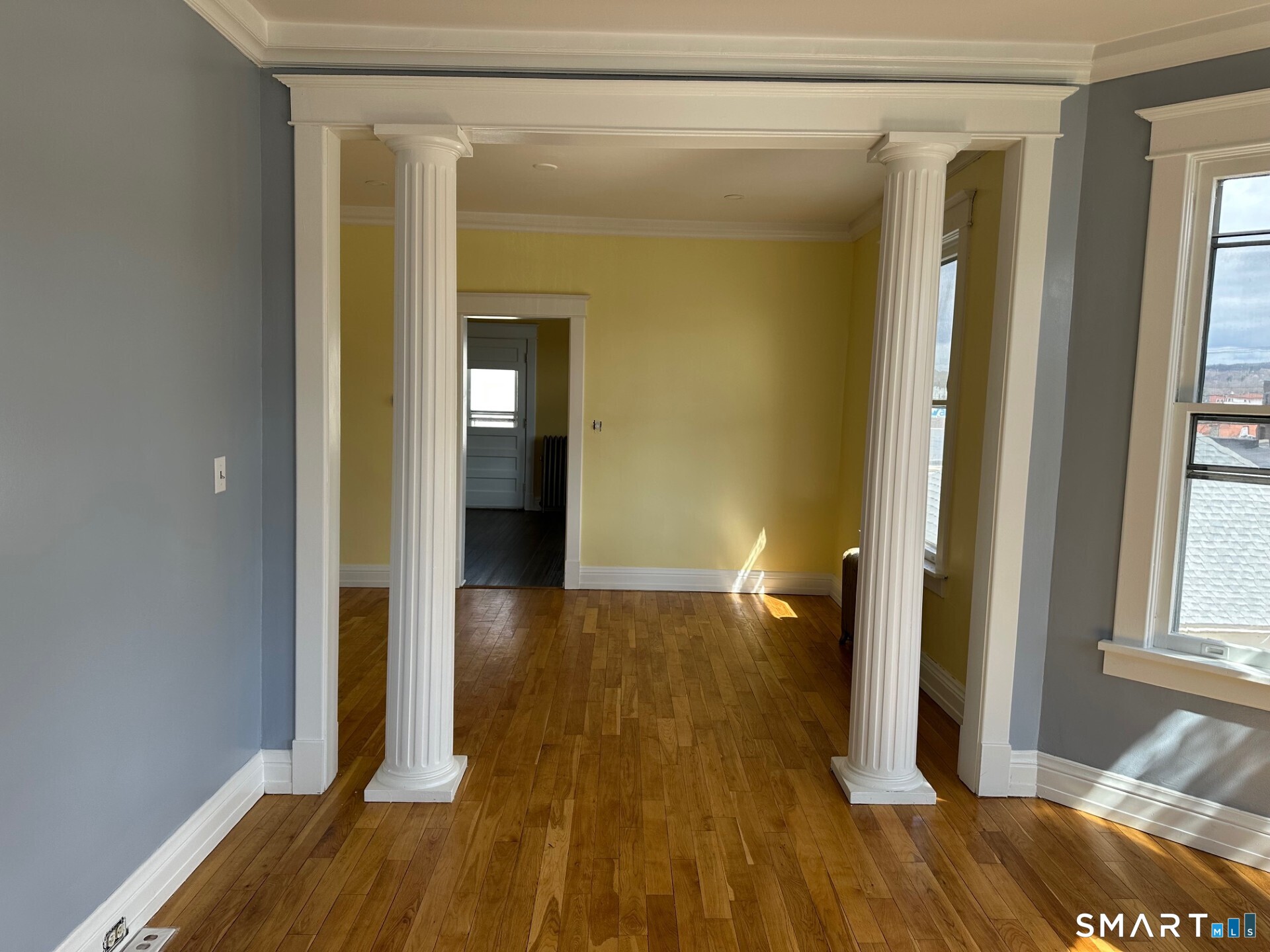 20 Taylor Street Torrington, CT 06790 - Photo 6 of 19 a view of hallway with wooden floor