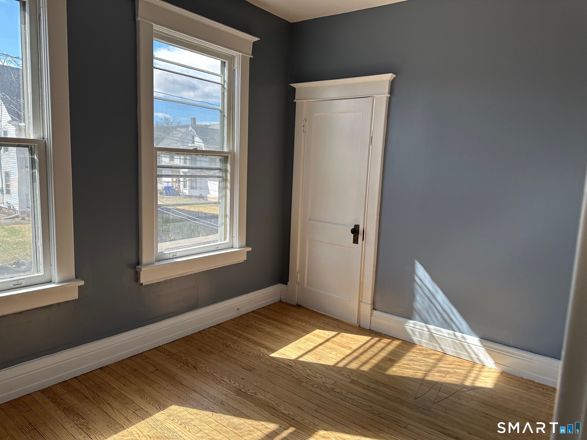 20 Taylor Street Torrington, CT 06790 - Photo 8 of 19 a view of empty room with wooden floor and fan