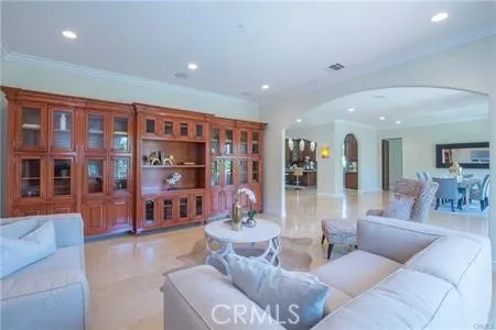 a living room with furniture and large window