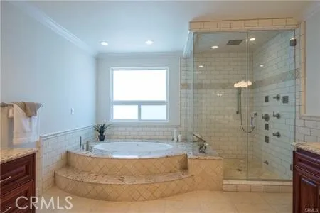 a bathroom with a granite countertop sink a toilet and bathtub