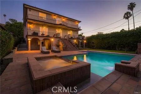 a view of a swimming pool with a patio