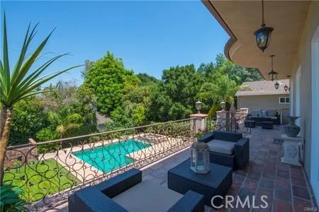 a view of a balcony with chairs