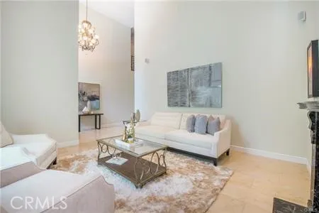 a living room with furniture and a mirror