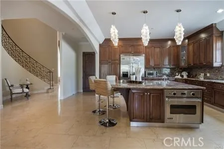 a kitchen with a sink cabinets and window
