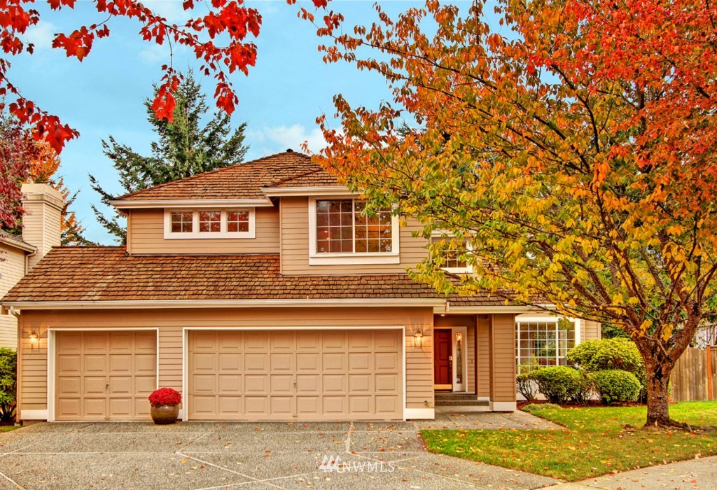19640 88th Place Northeast Bothell, WA 98011 - Photo 2 of 15 a front view of a house with a yard and garage