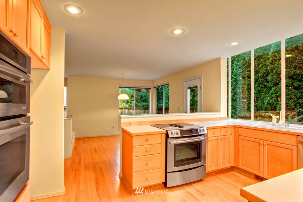 19640 88th Place Northeast Bothell, WA 98011 - Photo 8 of 15 a open kitchen with granite countertop a stove top oven
