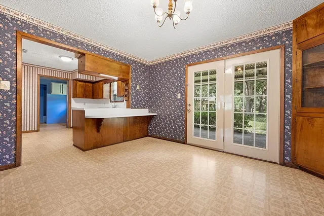 a spacious en suite bathroom with a large tub and shower