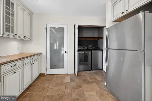 a view of a livingroom with furniture and a fireplace