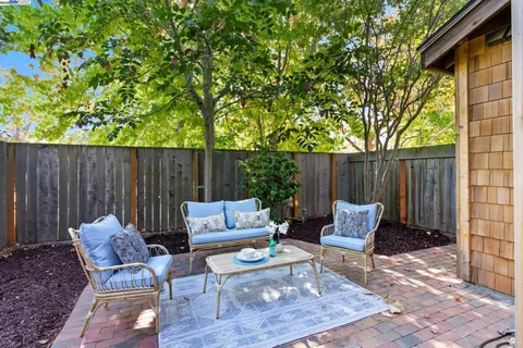 swimming outdoor sitting area with furniture and wooden floor
