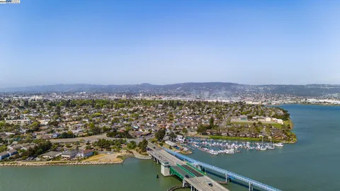 an aerial view of residential building and ocean