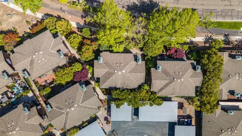 an aerial view of a house with a yard and garden