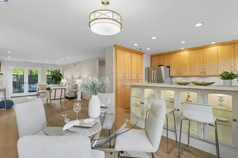 a living room with kitchen island furniture and a large window