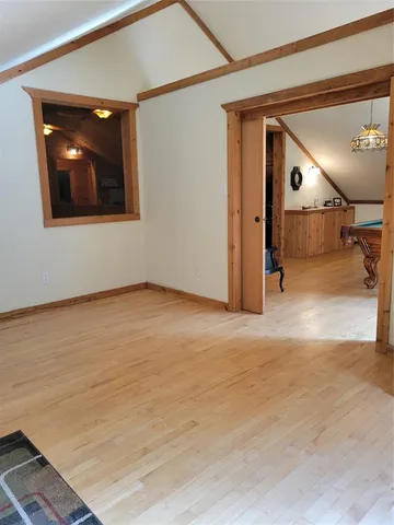 a bed room with a bed and a stool