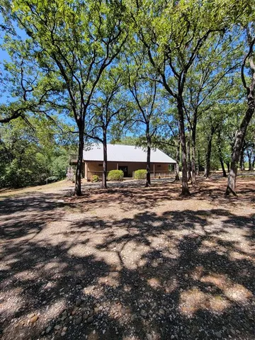 a view of outdoor space with deck and trees