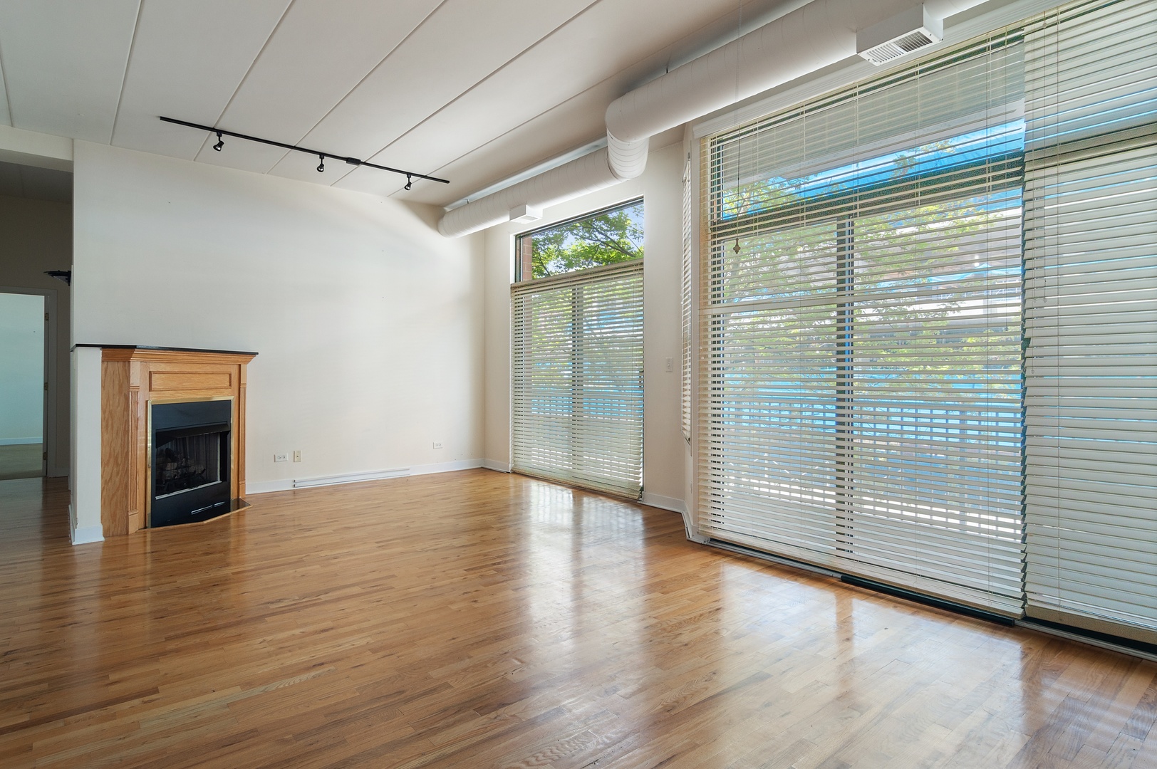 845 West Monroe Street, Unit 2F Chicago, IL 60607 - Photo 2 of 10 a view of an empty room with wooden floor and a window