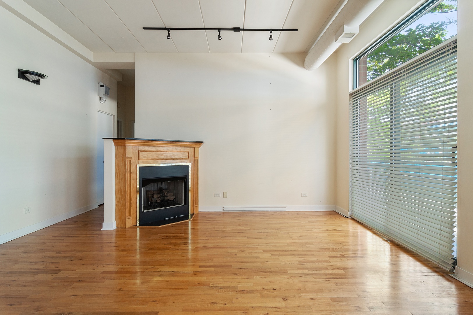 845 West Monroe Street, Unit 2F Chicago, IL 60607 - Photo 3 of 10 a view of an empty room with a window and fire place