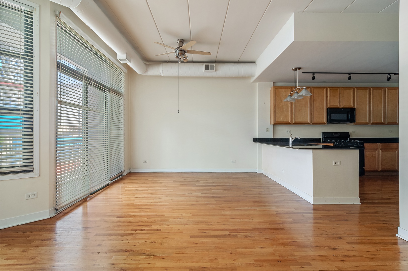 845 West Monroe Street, Unit 2F Chicago, IL 60607 - Photo 4 of 10 a view of kitchen with granite countertop window and stainless steel appliances