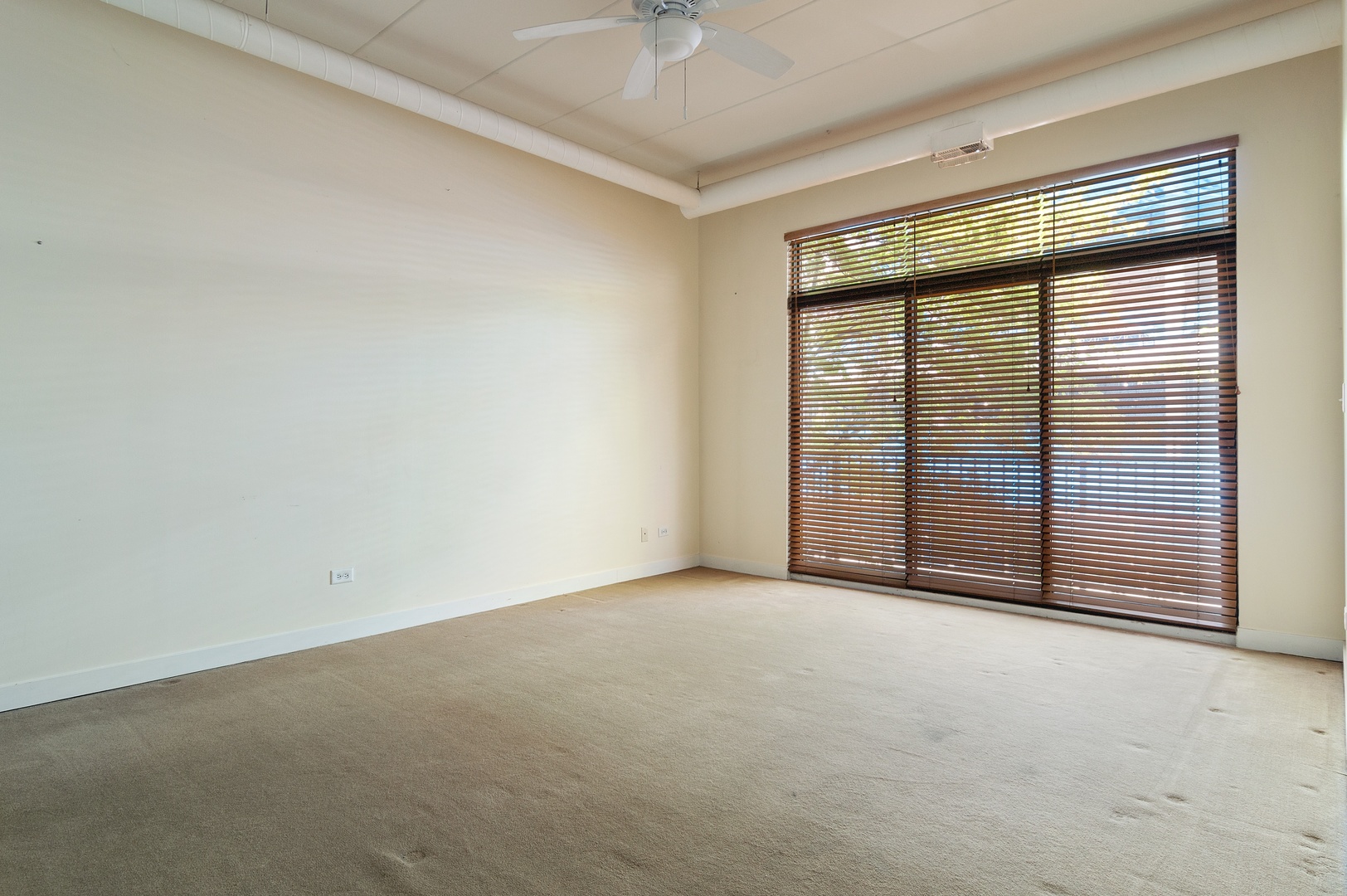 845 West Monroe Street, Unit 2F Chicago, IL 60607 - Photo 6 of 10 an empty room with windows