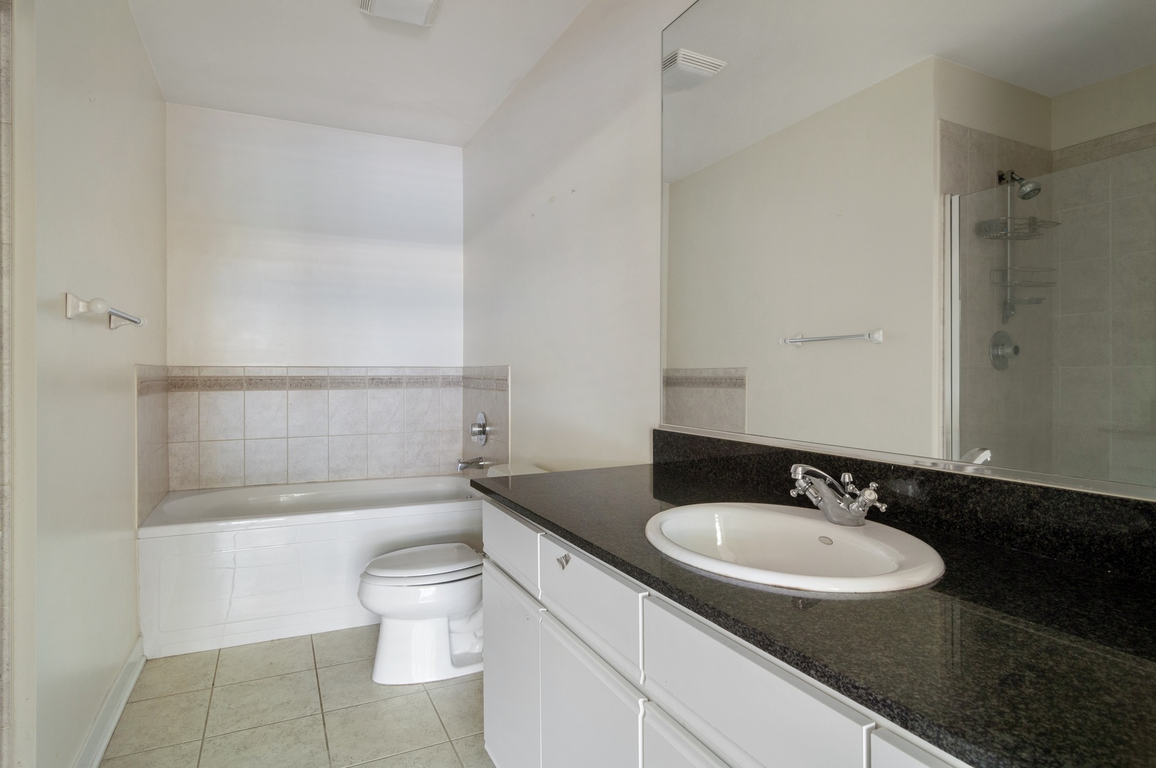 845 West Monroe Street, Unit 2F Chicago, IL 60607 - Photo 7 of 10 a bathroom with a sink and a mirror