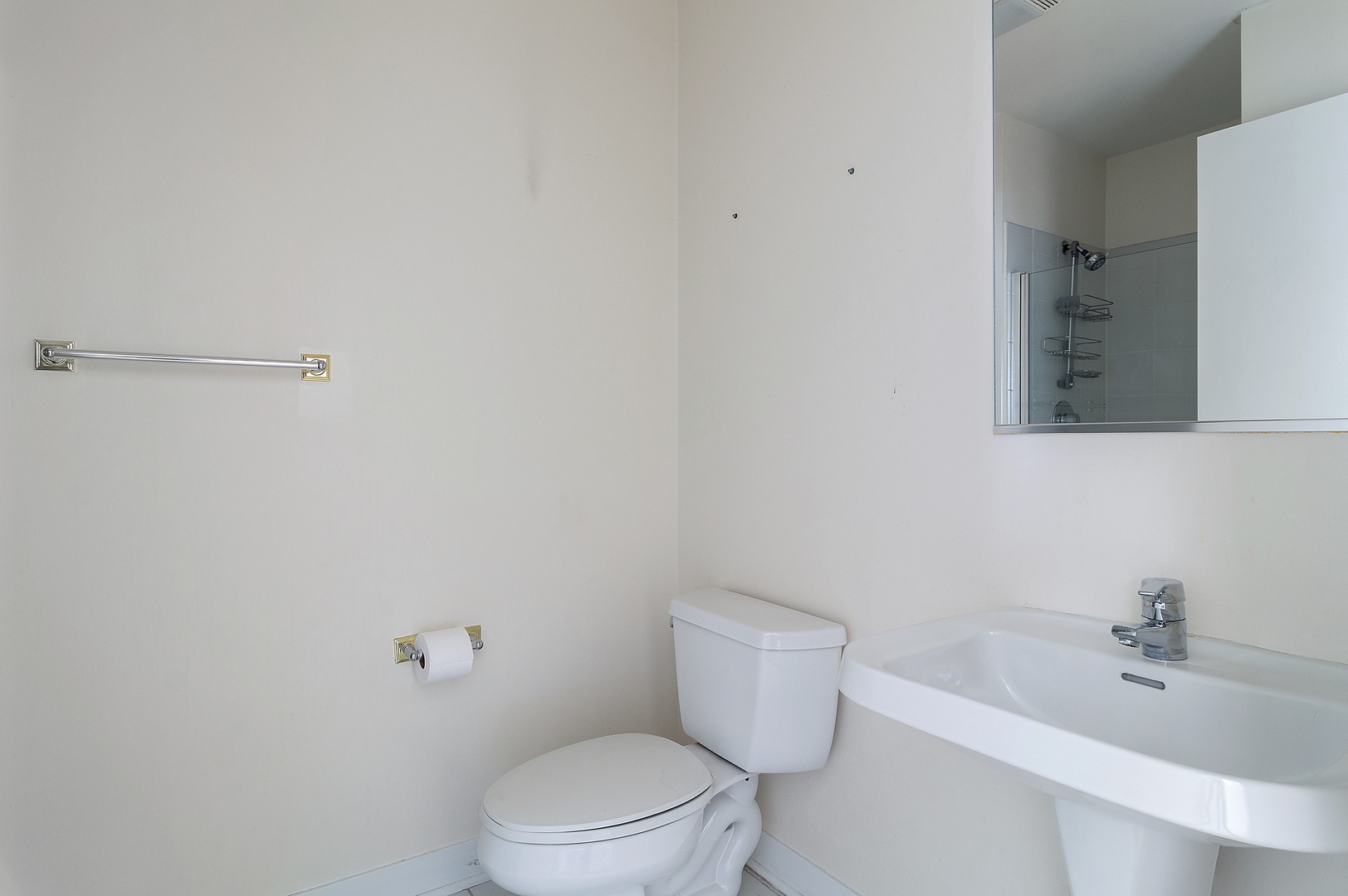 845 West Monroe Street, Unit 2F Chicago, IL 60607 - Photo 9 of 10 a white toilet sitting next to a bathroom sink