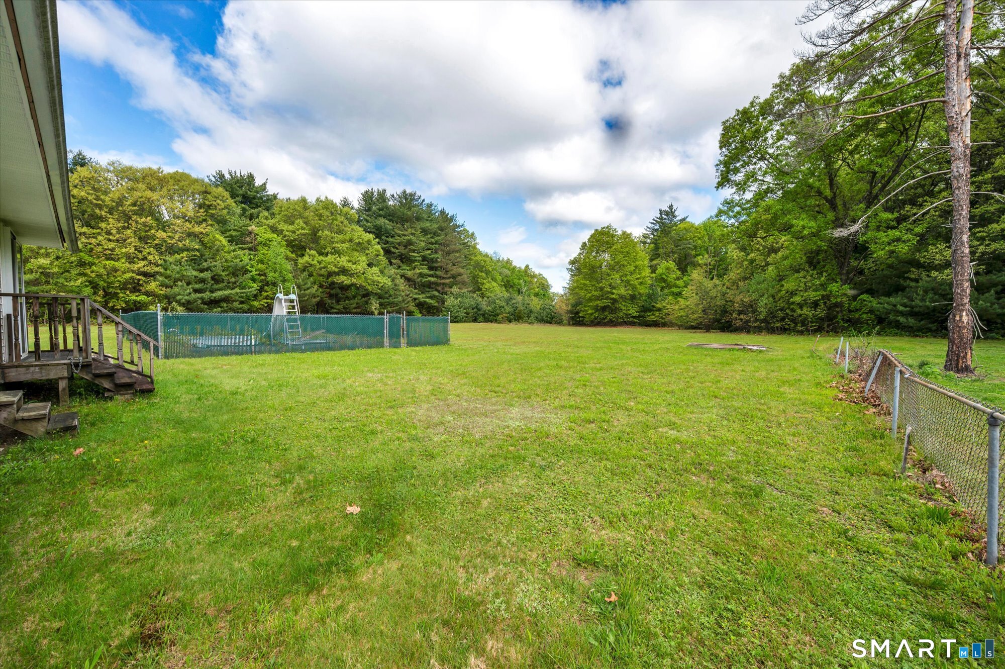 740 Rainbow Road Windsor, CT 06095 - Photo 3 of 40 a view of yard with swimming pool and green space