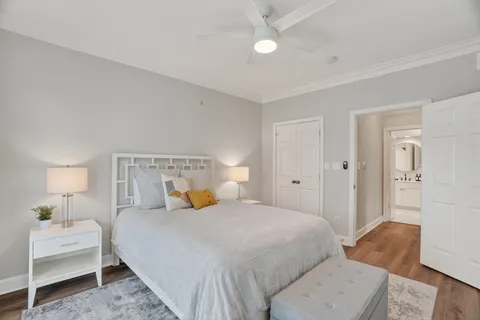 a bedroom with a bed and a lamp